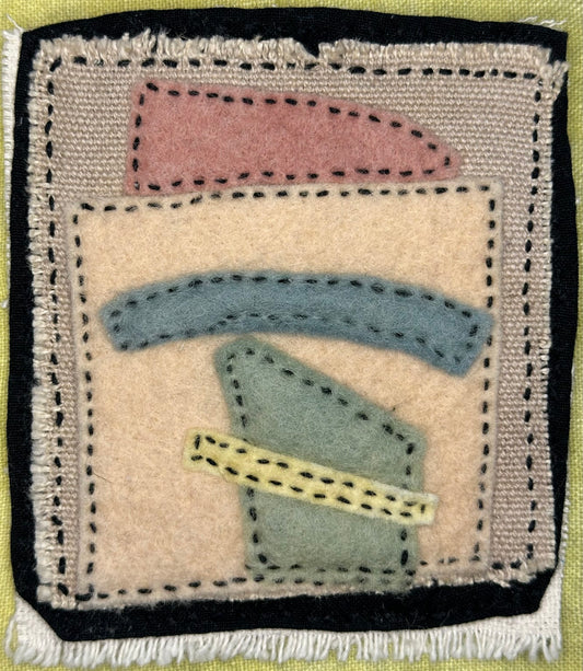 Fragments of Home textile art by Suzanne Gibbs with layered felt shapes and Sashiko stitching, exploring memory and belonging, mostly beige and black.