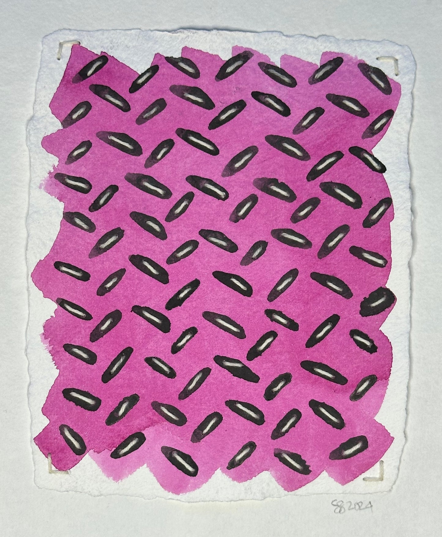 A small watercolor painting featuring a pink background with black Sashiko thread patterns, signed and dated by the artist, Suzanne Gibbs, on the front.