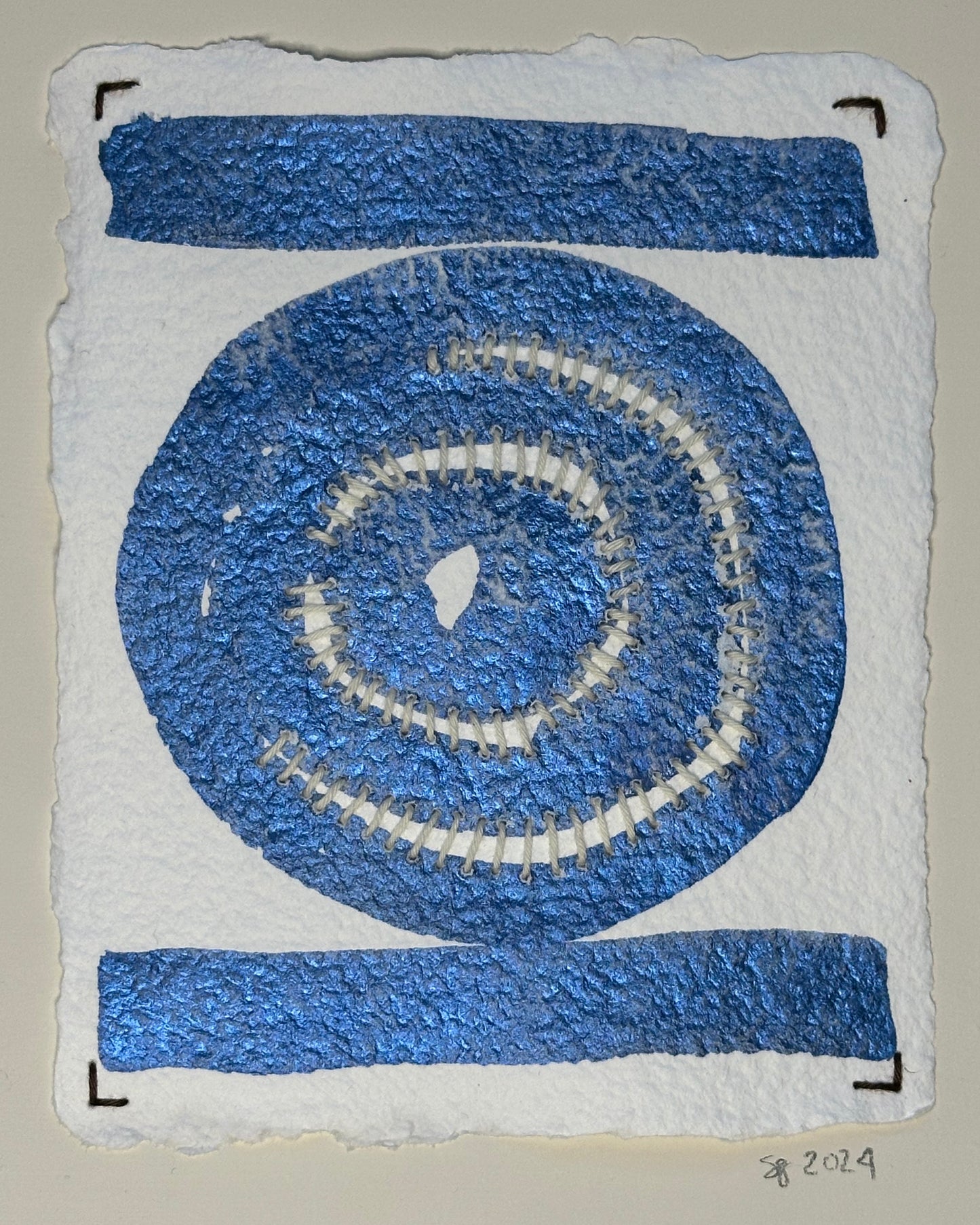 A watercolor painting by Suzanne Gibbs featuring a snail trail pattern with blue and white colors on a white background, signed and dated by the artist on the front.