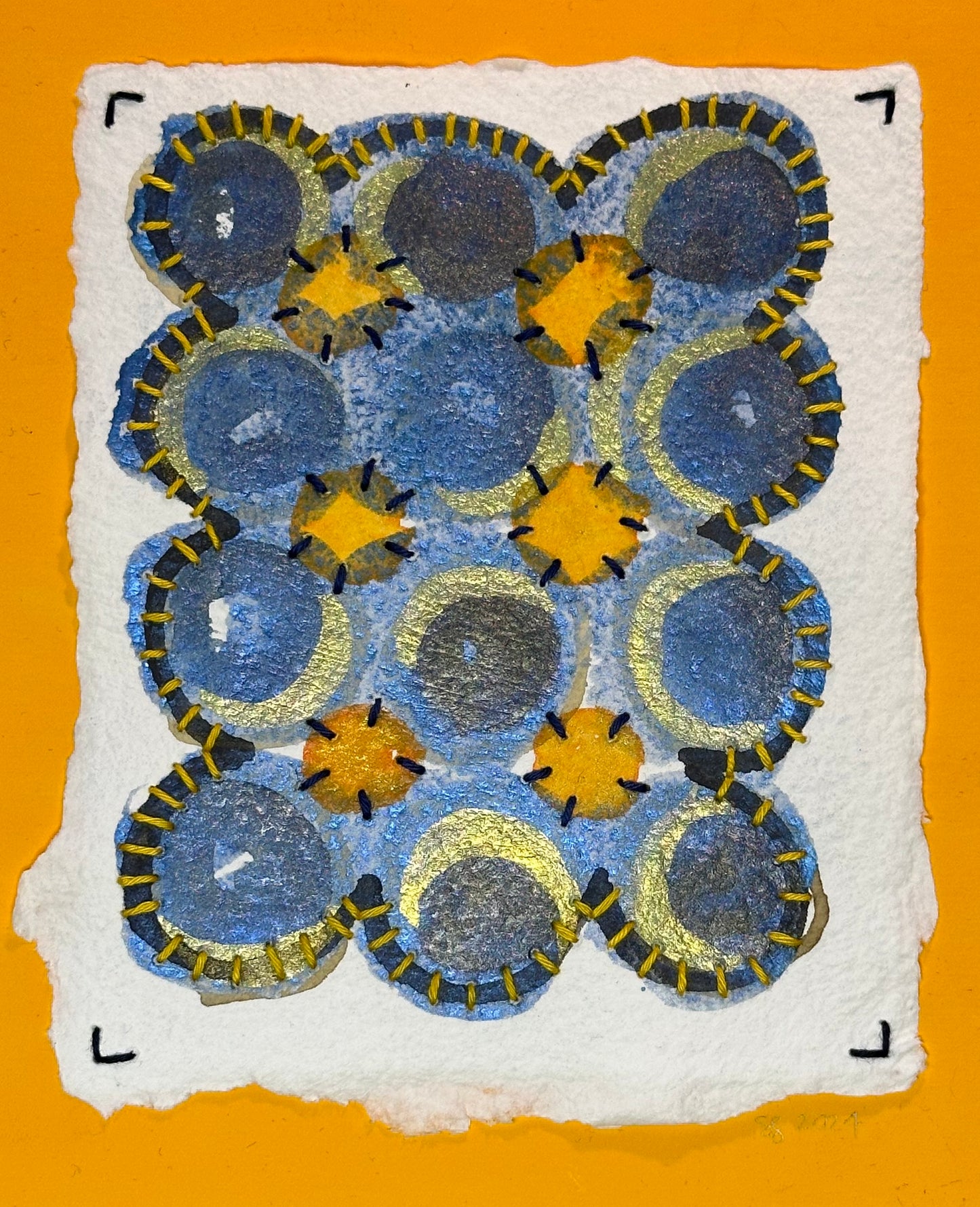 A watercolor painting featuring geometric patterns with blue and gold colors on a white background, signed and dated by the artist on the front.