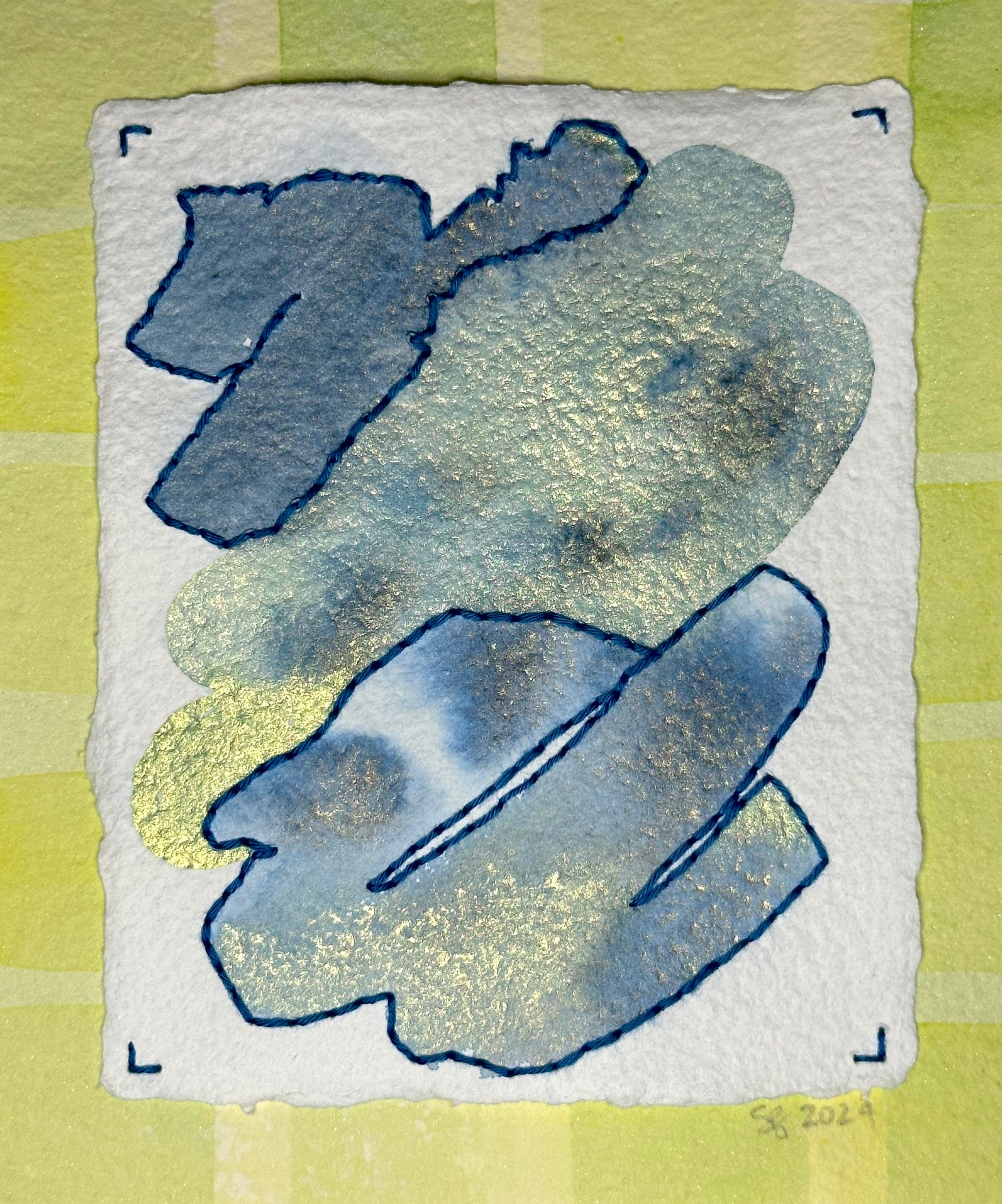 A small abstract watercolor painting on hand-crafted paper in lime and blue with stitched edge elements by Suzanne Gibbs of Portland, OR.