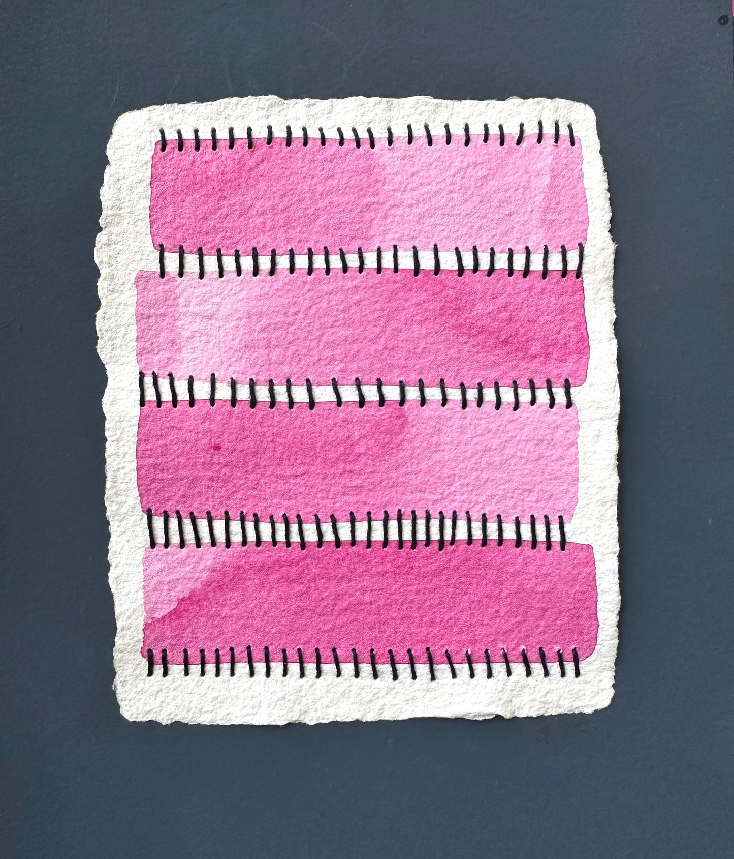 A watercolor painting featuring pink rectangles and blue Sashiko thread stitches on a white background and framed by navy blue paper by Suzanne Gibbs.