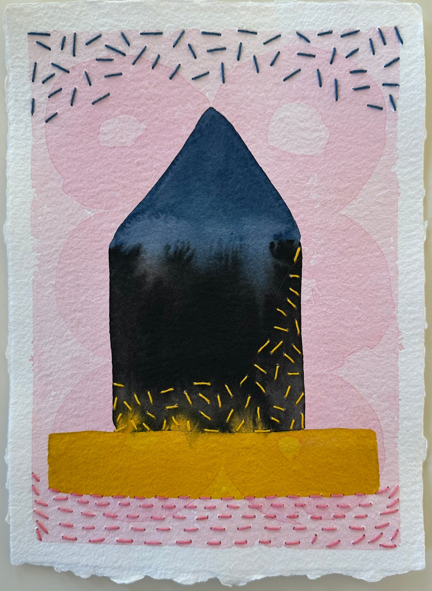 Fragments of Home #33, Icy Hot by Suzanne Gibbs, watercolor and Sashiko thread on paper, featuring a dark blue house form with yellow stitching on a gold base against a pale pink background.