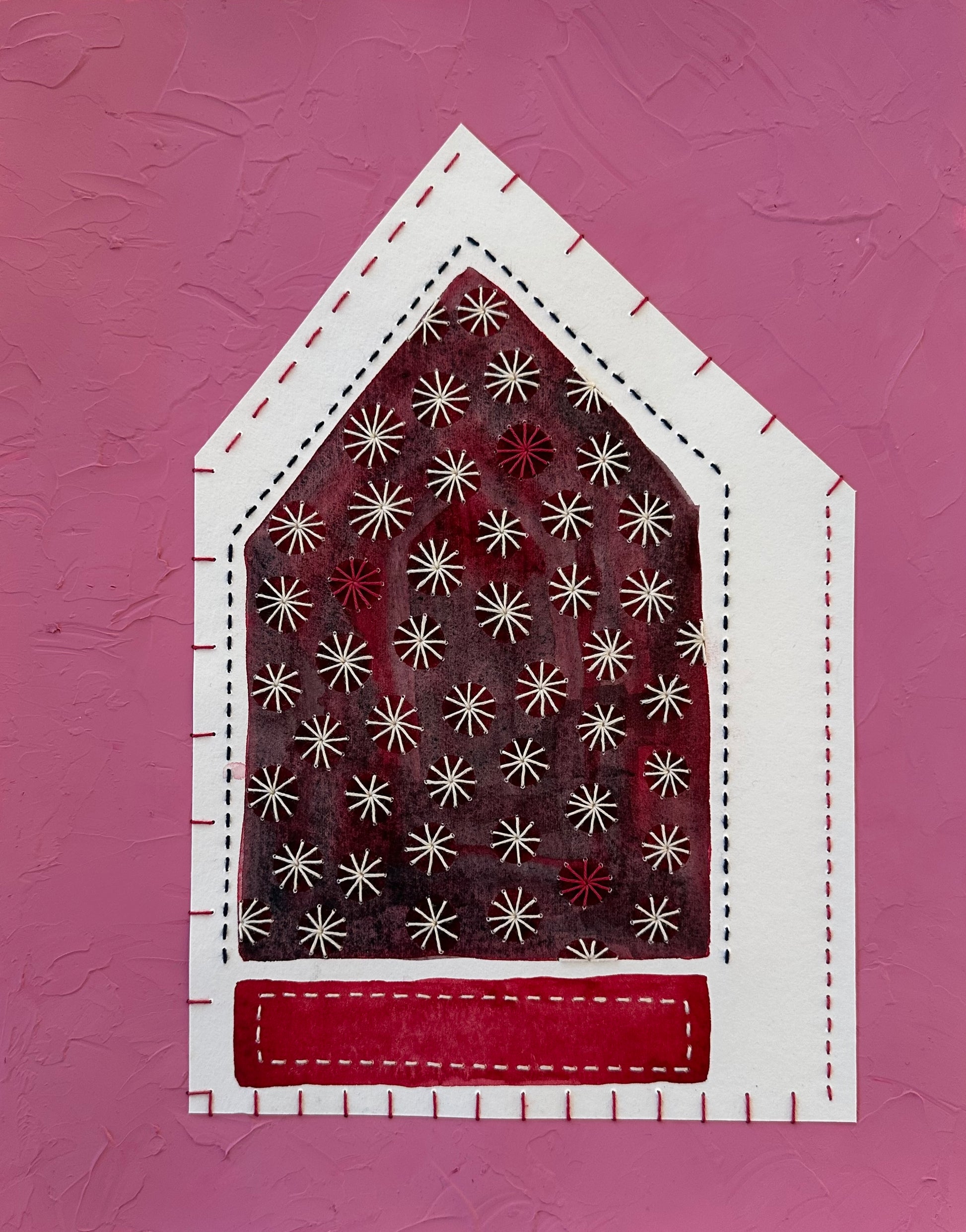 Fragments of Home #34, Snow Storm by Suzanne Gibbs, layered watercolor paper collage with Sashiko stitching, featuring a deep red house filled with white stitched snowflakes.
