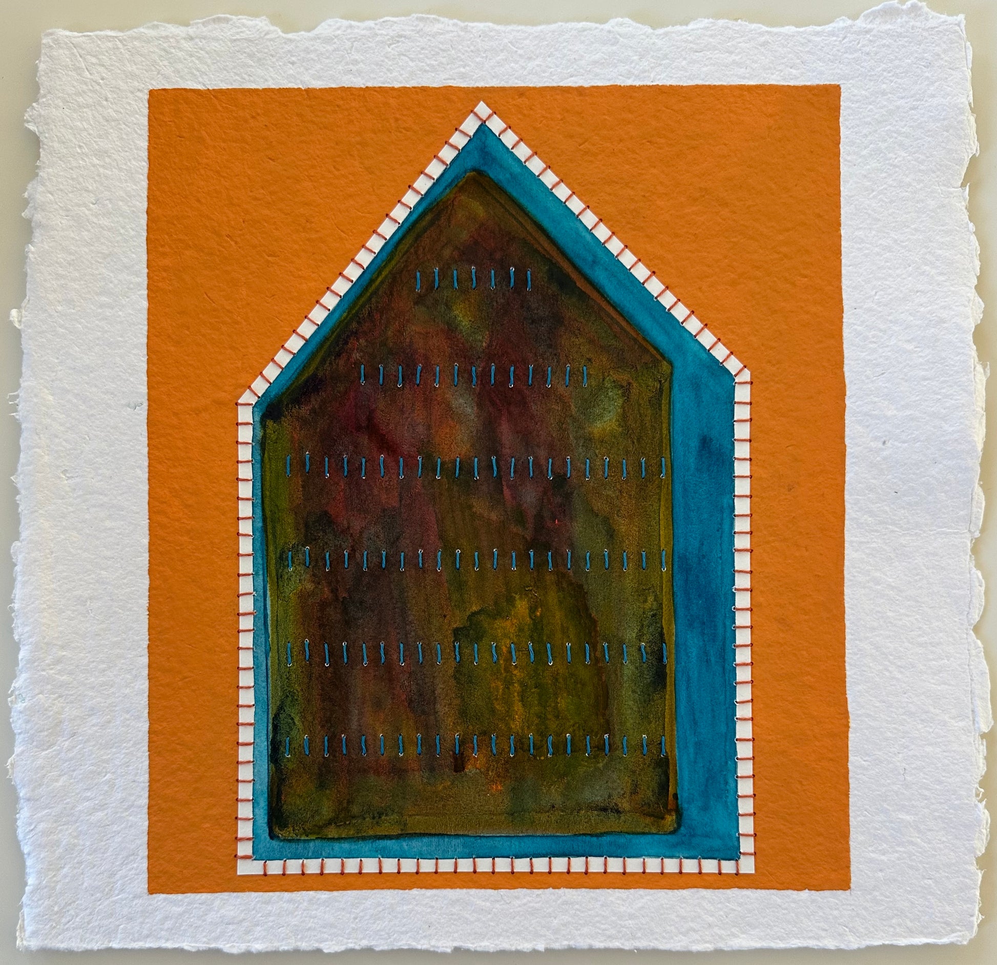 Fragments of Home #37, Difficult Space by Suzanne Gibbs. A house-shaped form in layered watercolor framed by teal and white stitched borders, set against a bold orange background.