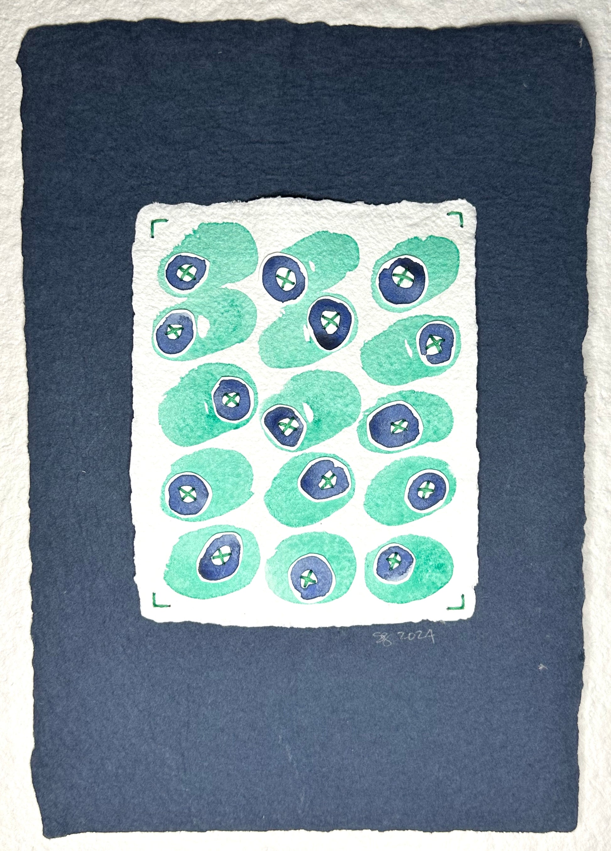 Mixed media artwork by Suzanne Gibbs from her Stitch & So series, created with watercolor paint and thread on handmade paper, featuring a grid of mint green and blue circular forms with teal stitched lines suggesting X's on a white background.