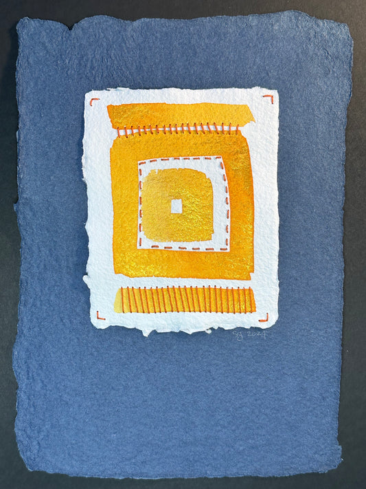 A watercolor painting featuring a bold geometric pattern with yellow and white on a blue handcrafted paper background, signed and dated by Suzanne Gibbs.