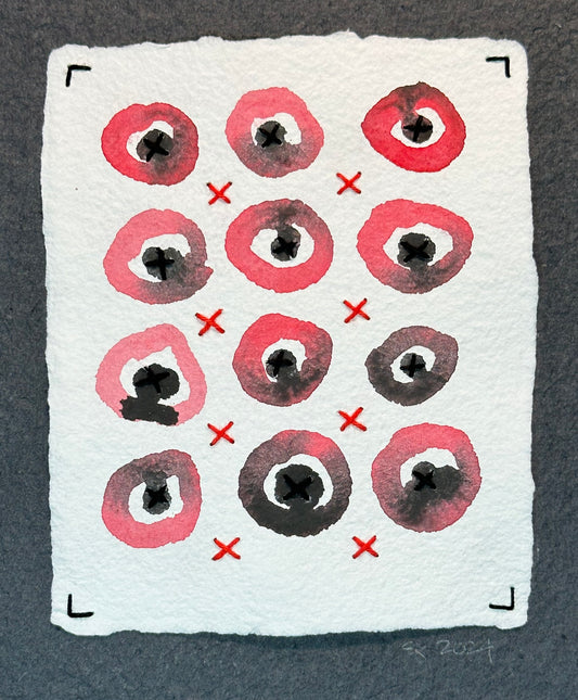 Mixed media artwork by Suzanne Gibbs from her Stitch & So series, created with watercolor paint and thread on handmade paper, featuring a grid of red circular forms with red and black stitched lines suggesting X's on a white background.