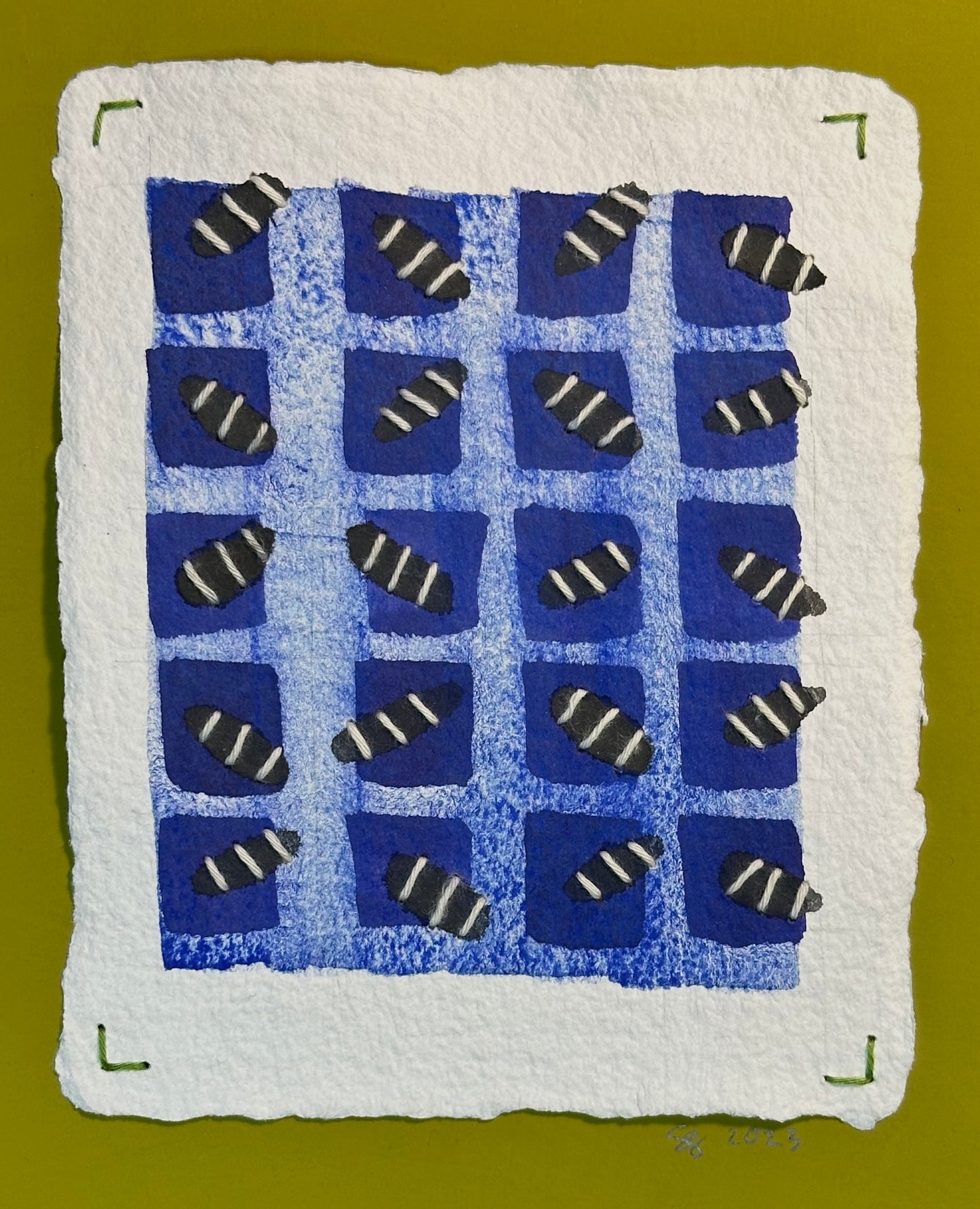 A watercolor and stitched painting featuring a grid of bugs in shades of blue on a white background, signed and dated by Suzanne Gibbs.