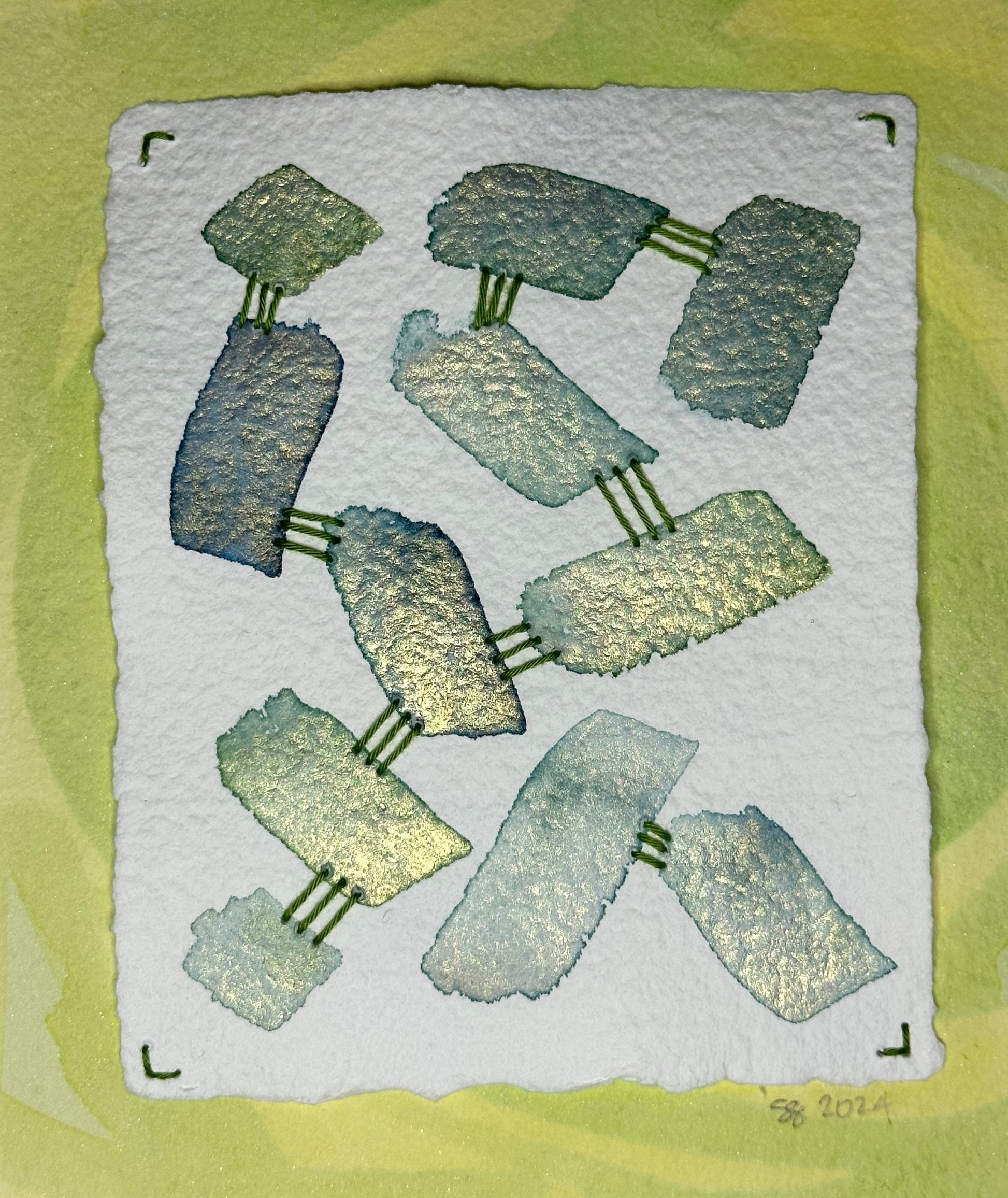 A watercolor, sashiko thread art piece on paper with a triple horizontal travel pattern made by Suzanne Gibbs of Portland, OR.