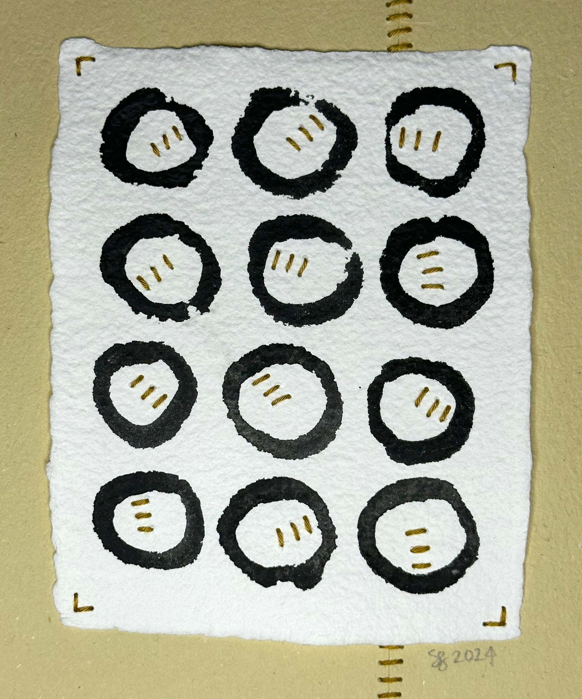 Original art by Suzanne Gibbs featuring twelve black circles on white paper painted in watercolor with stitched elements inside each circle.