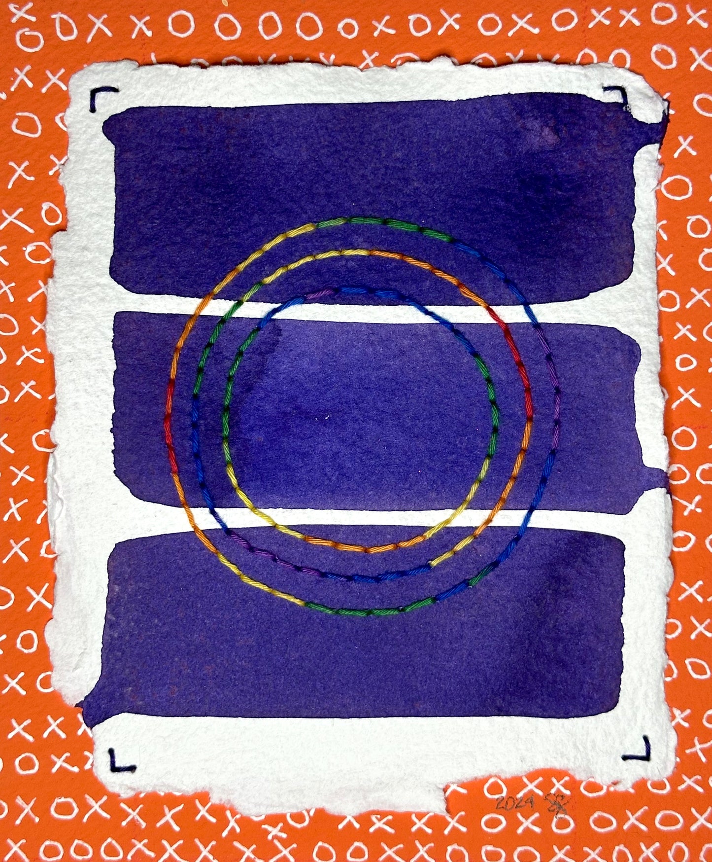 Art created by Suzanne Gibbs of Portland, OR, featuring stitched circles in rainbow colors on a background of three purple, painted rectangular sections over an orange pattern of X's and O's.