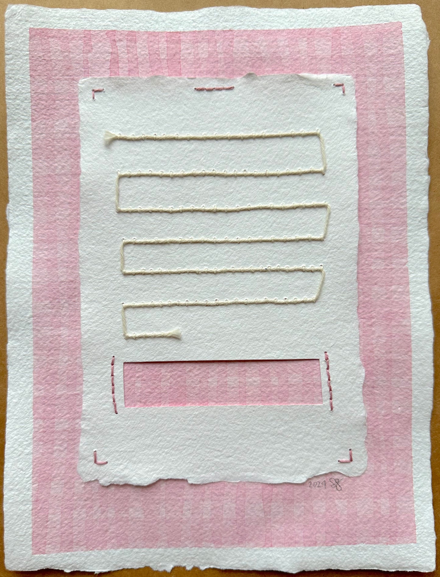 A handcrafted paper collage painting by Suzanne Gibbs featuring pink and white layers with stitched elements.