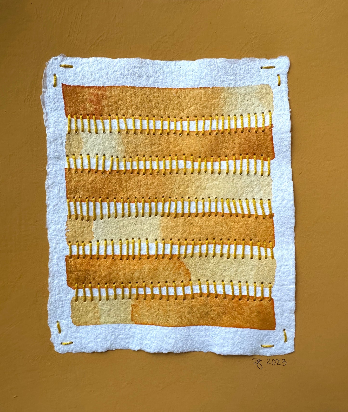 Mixed media golden abstract art by Suzanne Gibbs from her Stitch & So series, created with Flashe pint, watercolor paint and Sashiko thread on handmade paper.