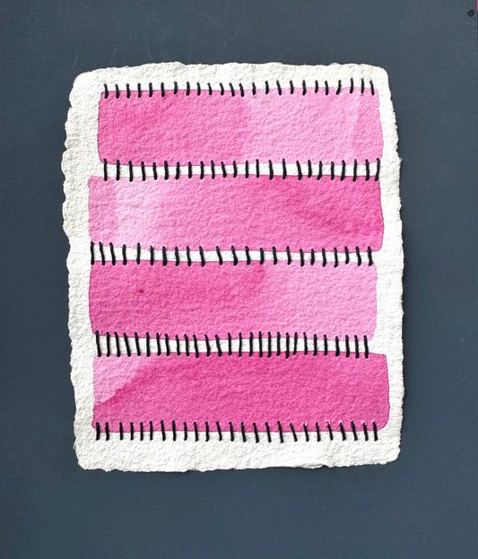 A watercolor painting featuring pink rectangles and blue Sashiko thread stitches on a white background and framed by navy blue paper by Suzanne Gibbs.