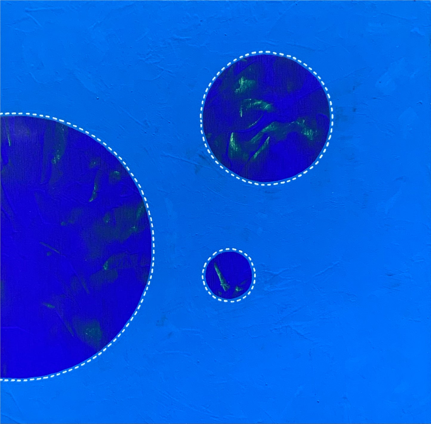 An abstract dot painting by Suzanne GIBBS with blue and royal blue colors, showing a textured surface with circles and minimalist markings.